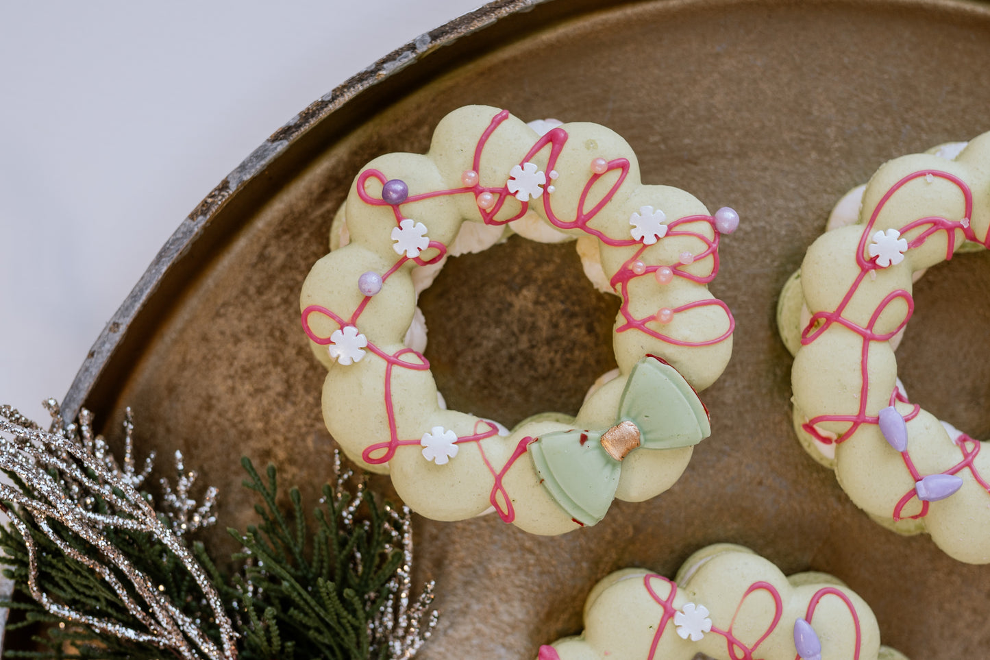 Macaron wreath filled with a French buttercream and raspberry compote.(12)